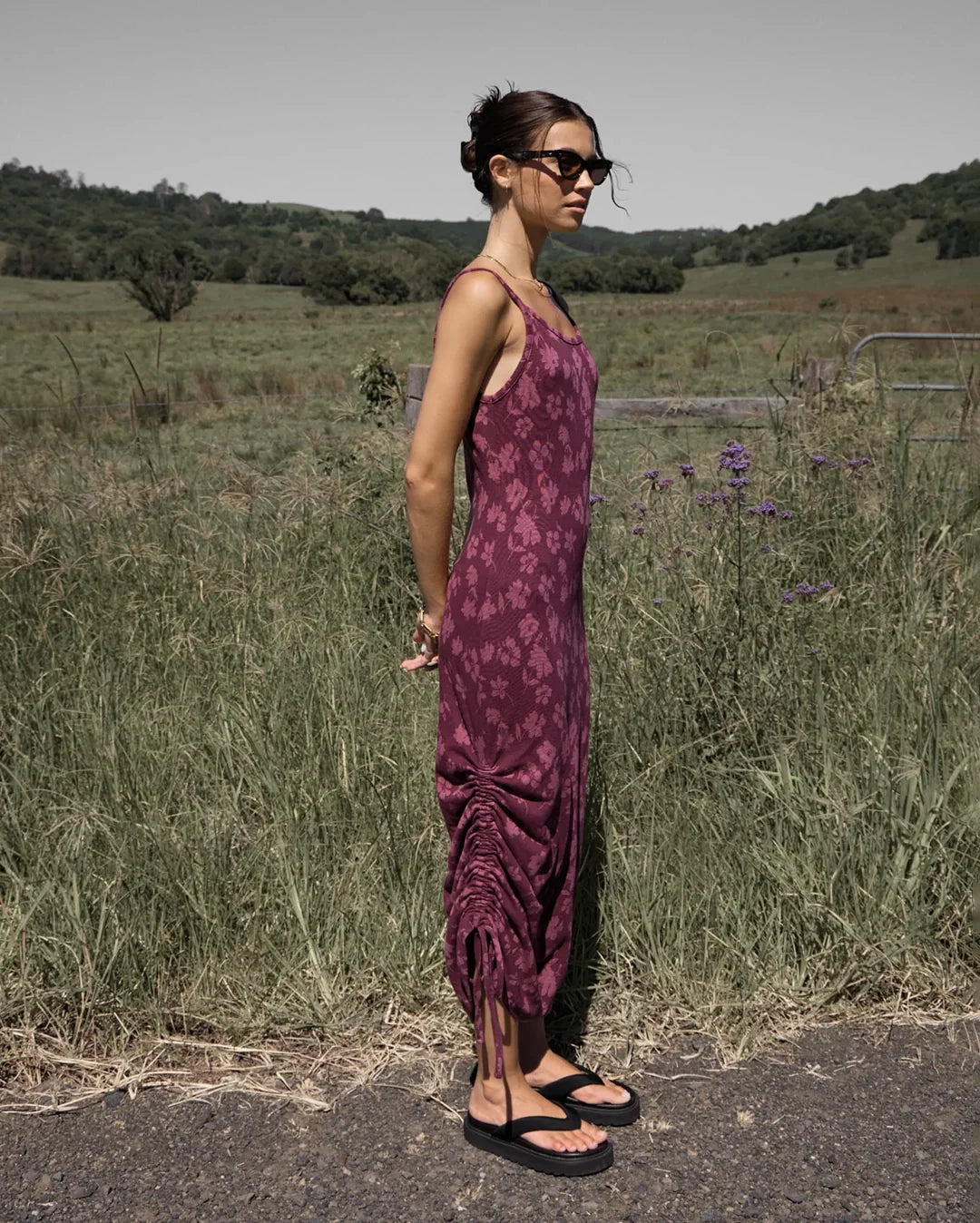 Woman wearing the Afends Marin maxi dress in port, photographed outdoors